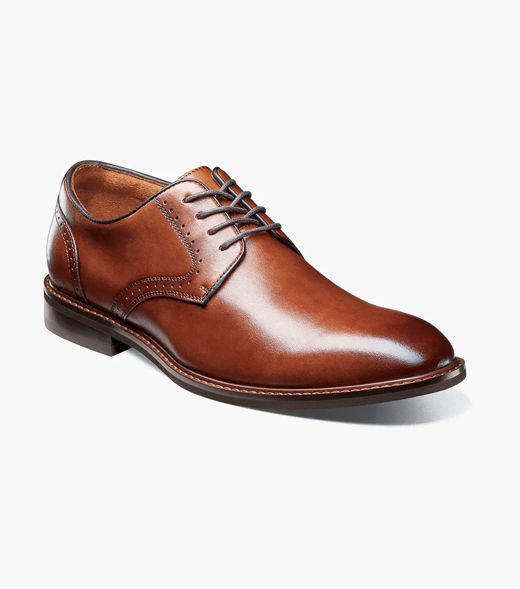 The Stacy Adams Benson Plain Toe Oxford in Brandy (25751-226) is a brown lace-up dress shoe made from hand-burnished leather, with a low heel and polished finish, shown on a white background.