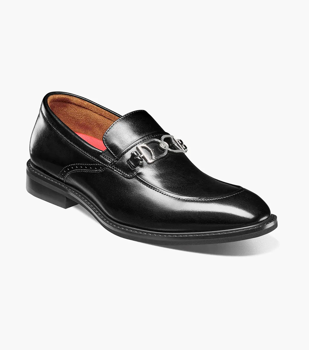 The Stacy Adams Boyd Moc Toe Bit Slip On (Black, 25753-001) features a black leather loafer design with a metal bit detail, low heel, moc toe, visible stitching, and a cushioned footbed for comfort.