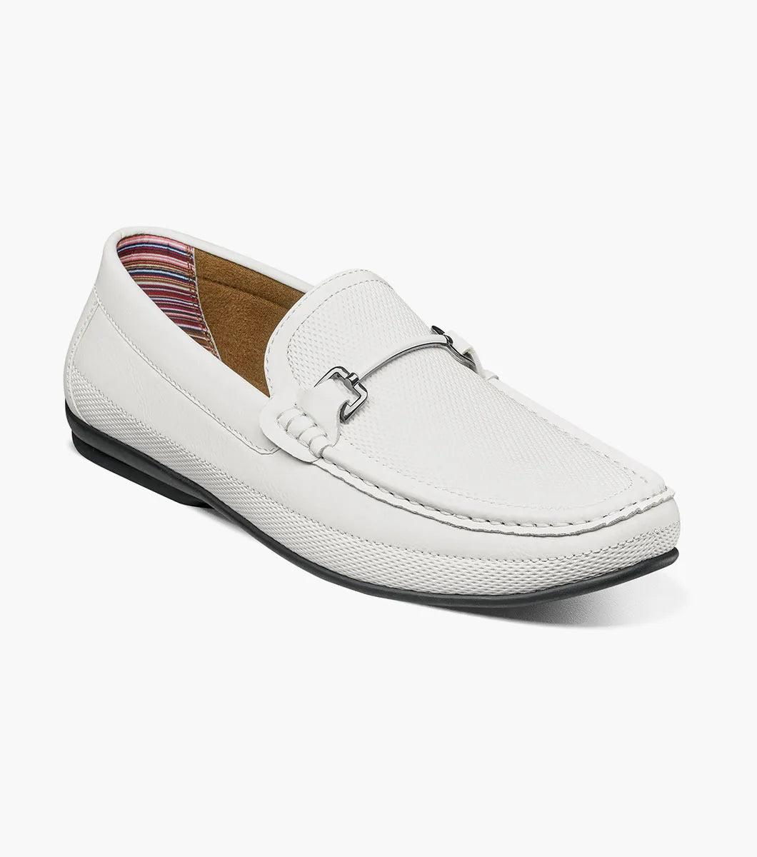 The STACY ADAMS Colton Moc Toe Bit Slip On (White, 25760-100) is a men's leather loafer with a silver bit detail, black sole, patterned heel lining, and cushioned footbed for all-day comfort.