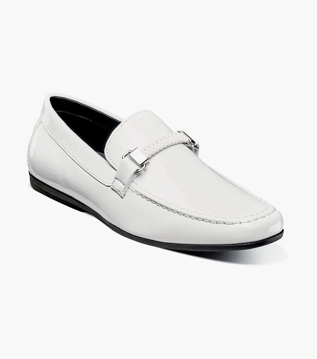 The STACY ADAMS Sheridan Moc Toe Bit Slip On (25761-122) is a white patent loafer with metal bit detail, a black sole, and visible stitching, shown on a plain white background.
