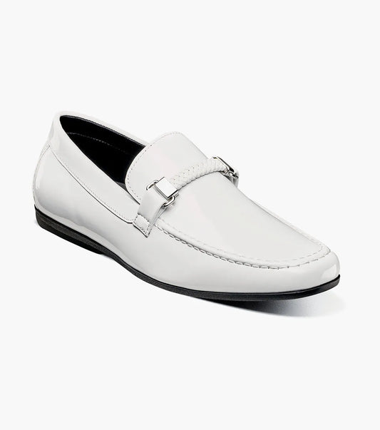 The STACY ADAMS Sheridan Moc Toe Bit Slip On (25761-122) is a white patent loafer with metal bit detail, a black sole, and visible stitching, shown on a plain white background.