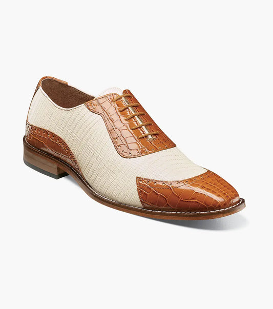 The STACY ADAMS Tarango Modified Cap Toe Oxford in Tan Multi (25770-238) blends tan leather and cream fabric with a closed lace design and low wooden heel—an ideal formal shoe for stylish men.
