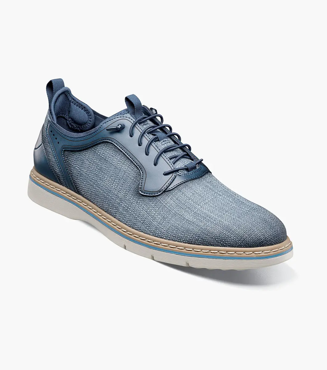 The Stacy Adams Sebert Plain Toe Elastic Lace Up in Navy (25771-410) features a textured upper, smooth leather accents, and a light rubber sole—offering stylish comfort for men. Shown on a plain white background.