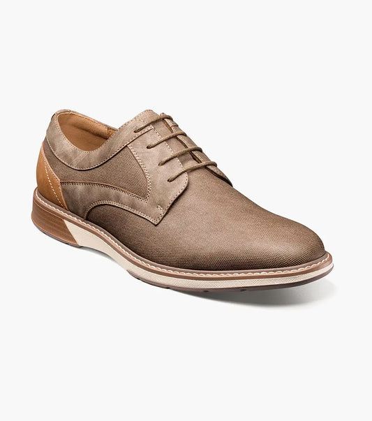 The Stacy Adams Phineas Plain Toe Oxford in taupe features a leather and fabric upper, cushioned insole, white midsole, and brown heel and sole accents. Shown in side profile on a white background.