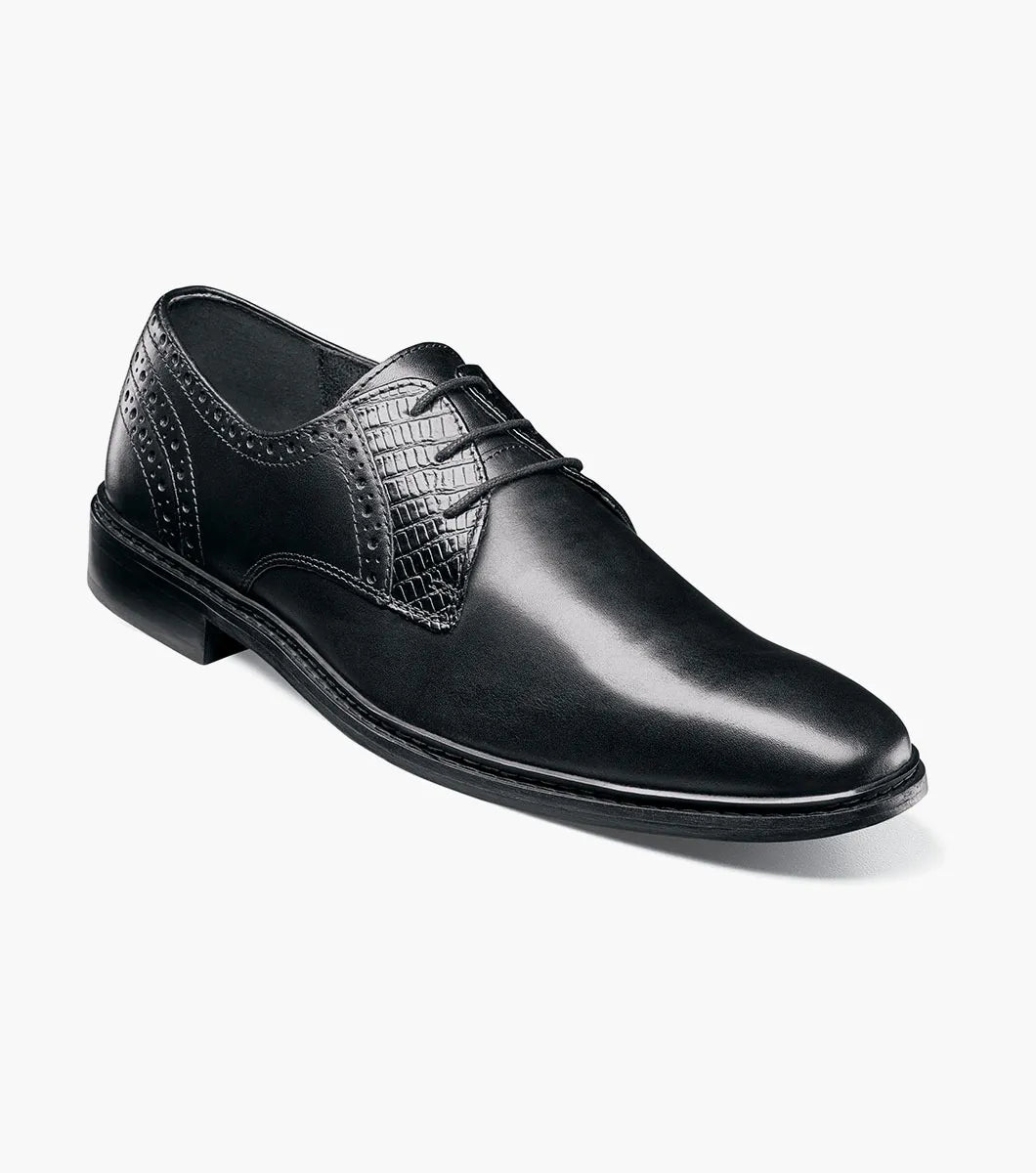 The Stacy Adams Giorgetti Plain Toe Oxford in black features lizard print leather, a low heel, lace-up closure, textured accents by the laces, and a cushioned footbed, shown on a plain white background.