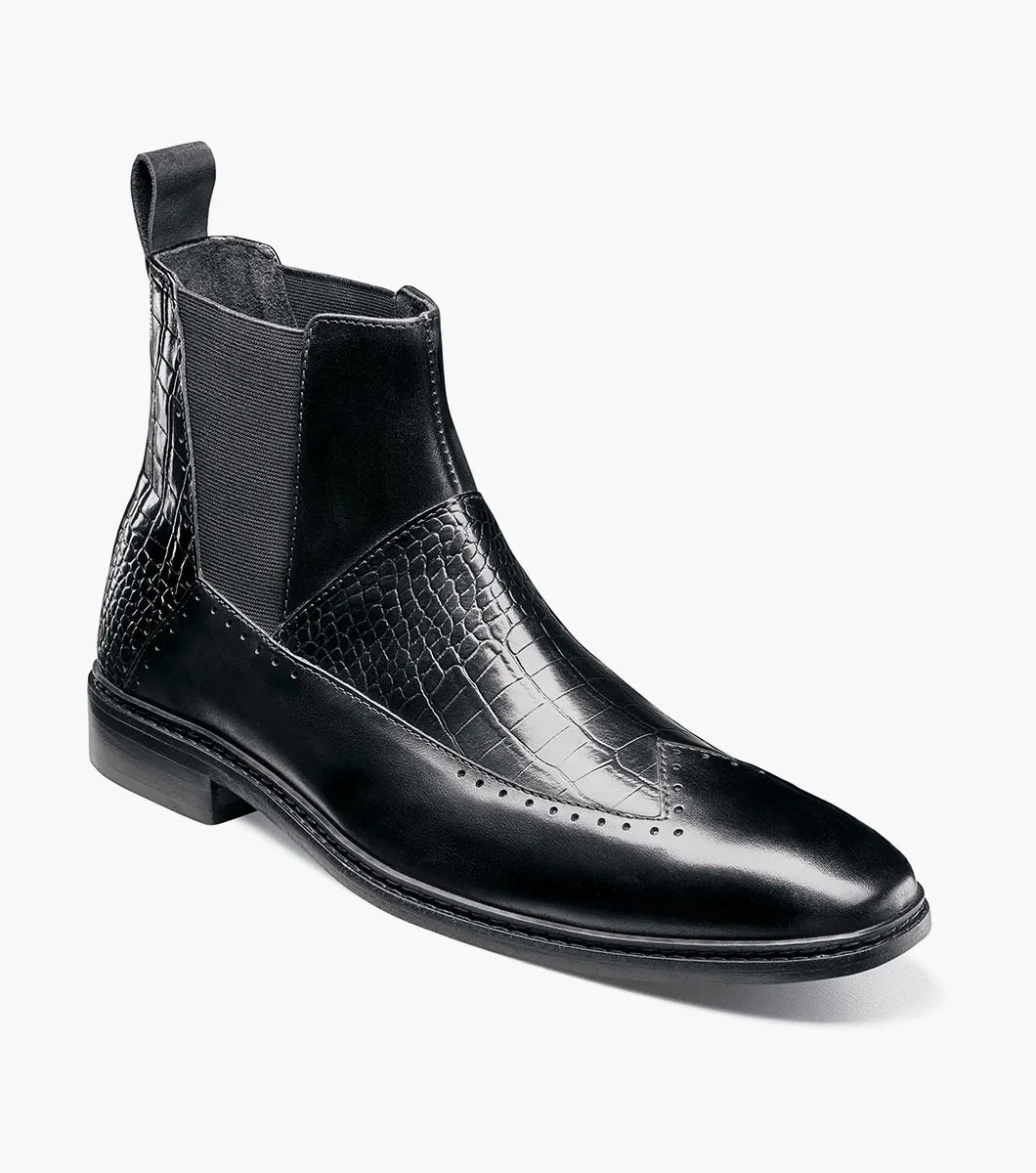 The Stacy Adams Garza Wingtip Chelsea Boot (Black, 25782-001) features crocodile texture accents, elastic side panels, a heel pull tab, and a low heel on a flat sole.