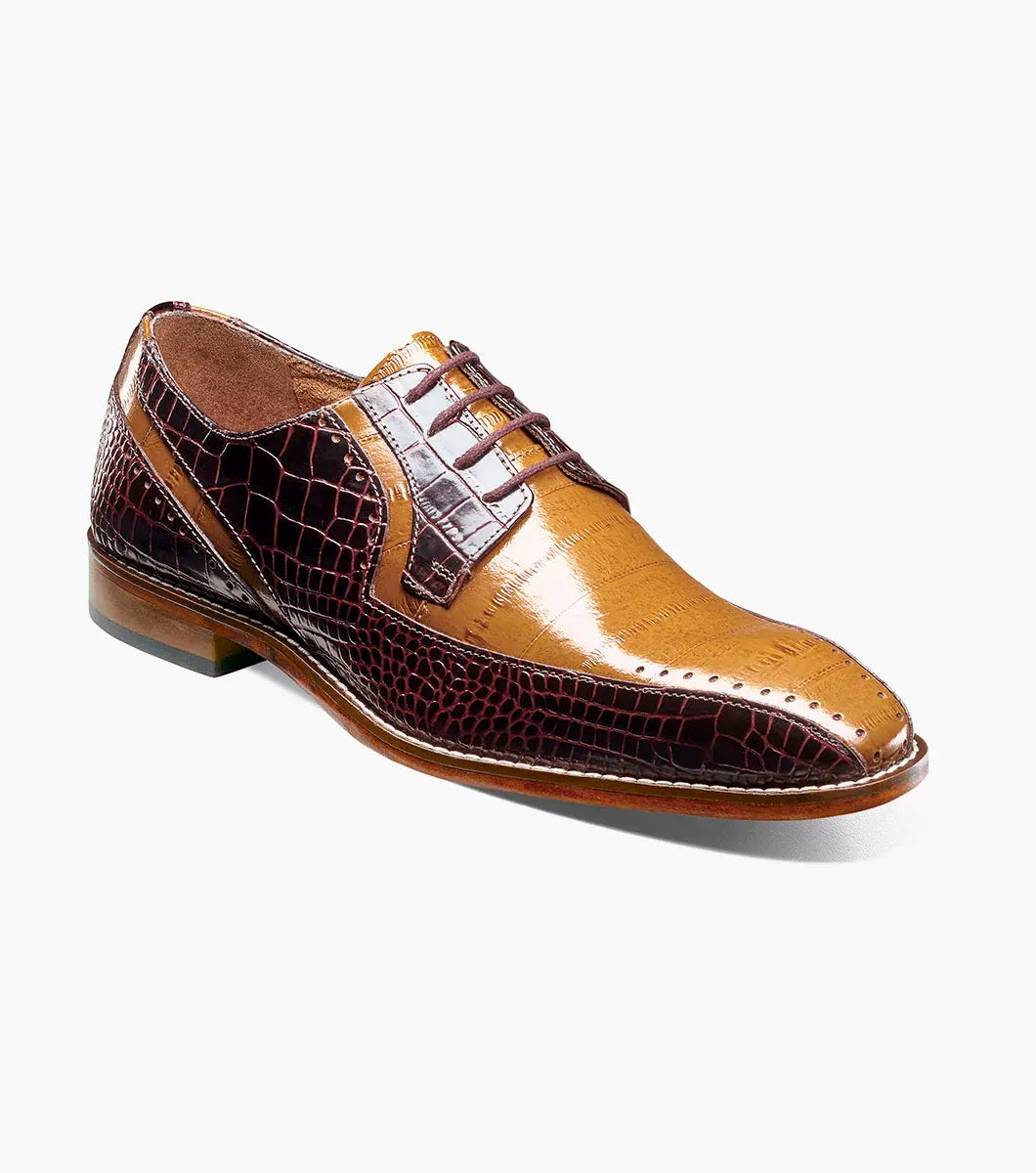The Stacy Adams Talamanco Bike Toe Oxford in Brown Multi (style 25788-249) showcases a two-tone design with tan and dark brown crocodile print leather, laces, and a low heel, set against a plain white background.