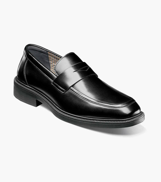The STACY ADAMS Everett Moc Toe Penny Slip On (style 25790-001) is a single black leather loafer featuring a low heel, polished finish, moc toe stitching detail, and a cushioned insole for enhanced comfort, shown against a plain white background.