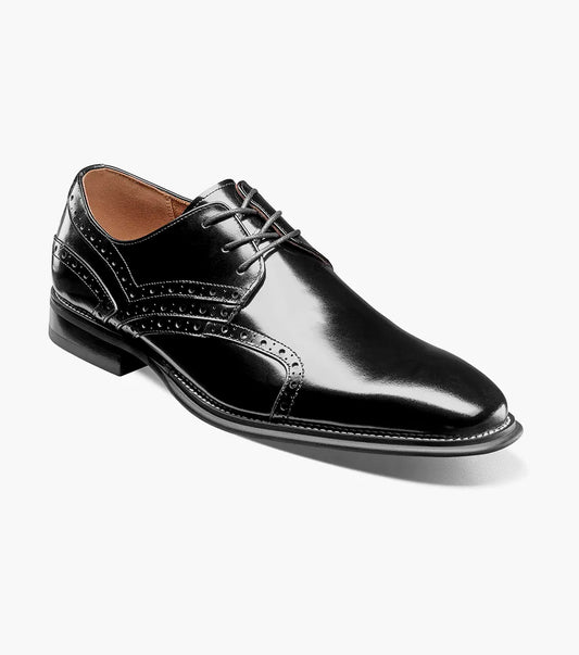 The STACY ADAMS Alexander Plain Toe Oxford in black (style 25791-001) is an elegant calf leather dress shoe with laces, decorative perforations, a low heel, and a comfortable memory foam insole, displayed on a light background.