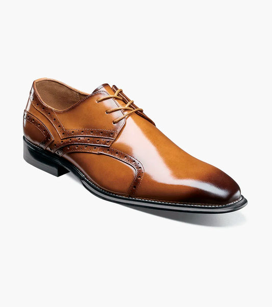 The Stacy Adams Alexander Plain Toe Oxford in tan (25791-240) is a single men’s dress shoe made from brown calf leather, featuring elegant brogue detailing and laces. Photographed against a white background, it offers enhanced comfort with Memory Foam cushioning.