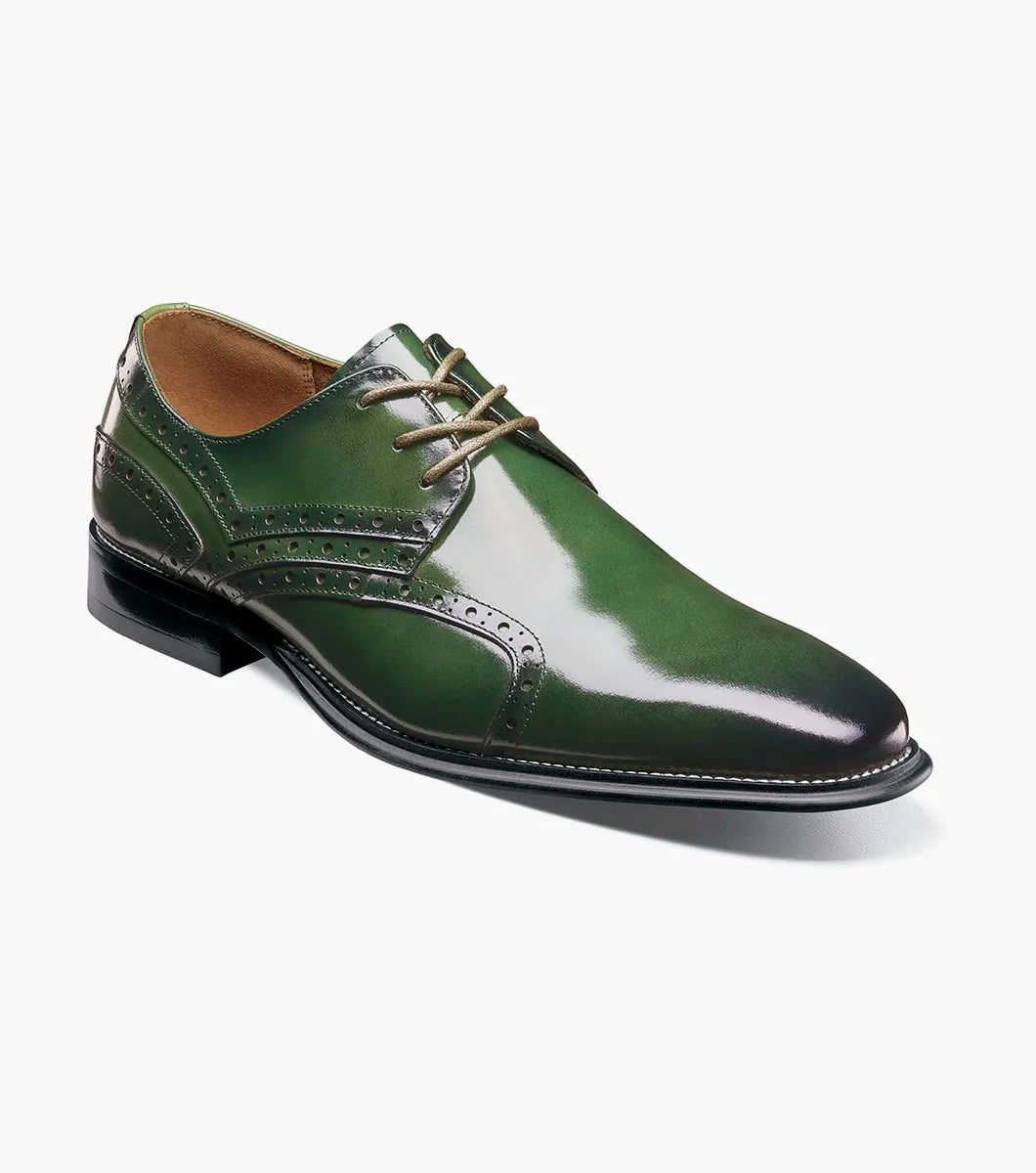 The Stacy Adams Alexander Plain Toe Oxford (25791-300) in polished green calf leather features decorative stitching and perforations, classic laces, a low black heel, and a comfortable Memory Foam insole—all showcased against a plain white background.