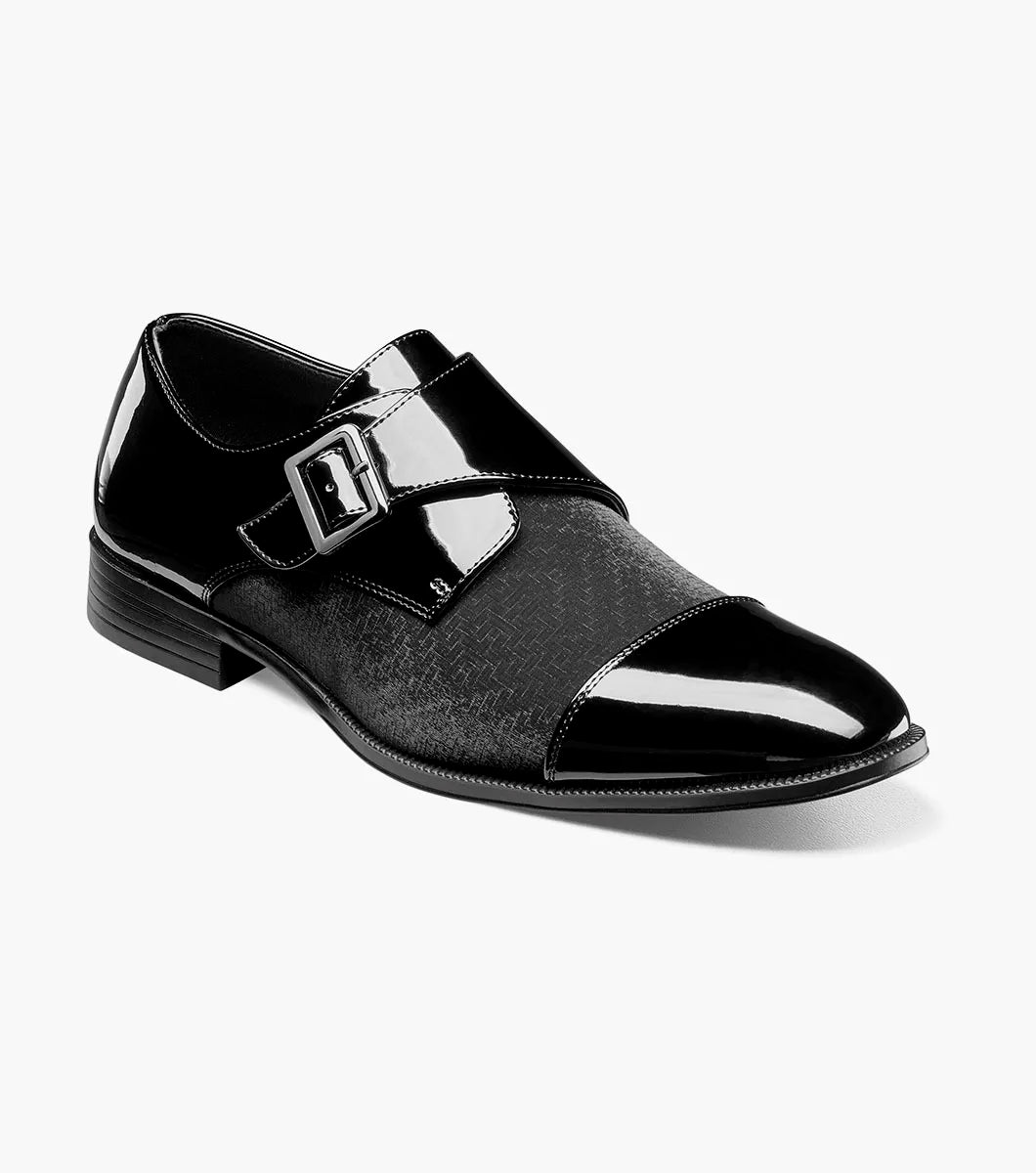 The STACY ADAMS Sutherland Cap Toe Monk Strap in black (style 25793-001) is a formal leather dress shoe with a glossy cap toe, single side buckle, and low heel, shown against a plain white background. These monk strap shoes are designed for all-day comfort with a memory foam insole.