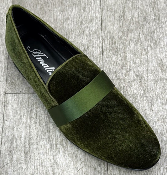 One Exclusive Formal Dress Shoe Dark Green 7021 from UNIQUE DESIGN MENSWEAR, crafted in green velvet with a glossy strap and genuine suede leather, rests elegantly on a light wooden floor.