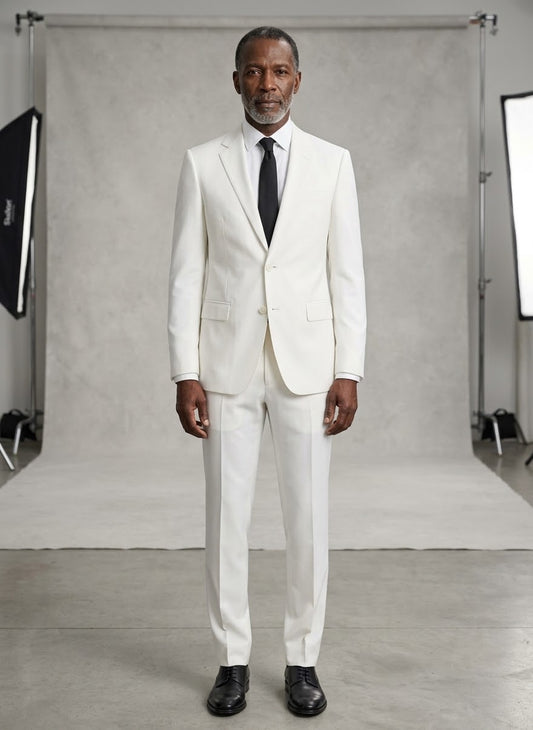 A man wearing the Tiglio Luxe Novello Off-White Pure Wool Men’s Suit, paired with a crisp white shirt and black tie, stands facing forward with a neutral expression against a plain white background.