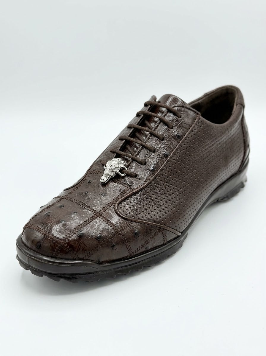 The Los Altos Avestruz Preforated Ostrich Lace Up Casuals in brown, by Los Altos, features textured leather reminiscent of ostrich leg footwear and a metallic bull head ornament on the laces, displayed against a plain white background.