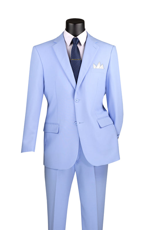 The mannequin displays a Vinci Suits Single Breasted Poplin Dacron Suit (Light Blue) 2PP with a white shirt, navy tie, two-button closure, flat front pants, and a white pocket square.