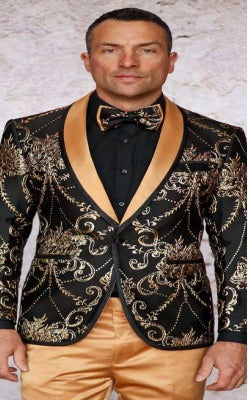 Model wearing the INSOMNIA MZS-550 BLACK Blazer by Insomnia, featuring gold floral embroidery and lapels, with a matching bow tie, black shirt, and gold pants, posed against a light textured background.