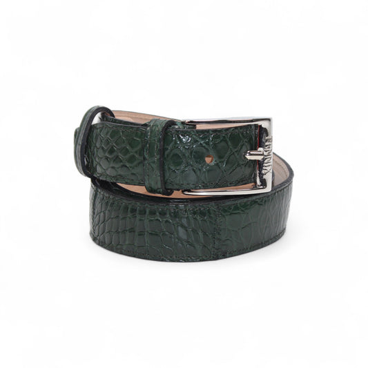 The Matiste Green Alligator Leather Belt 301 by Matiste features dark green crocodile-embossed leather and a shiny silver buckle, shown rolled on a white background.
