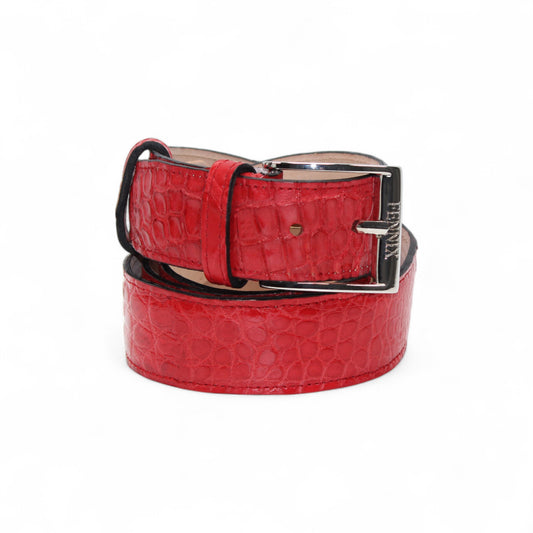 The Matiste Red Alligator Leather Belt 301, a red handcrafted Italian belt with a crocodile pattern and silver buckle, is shown rolled up on a white background.