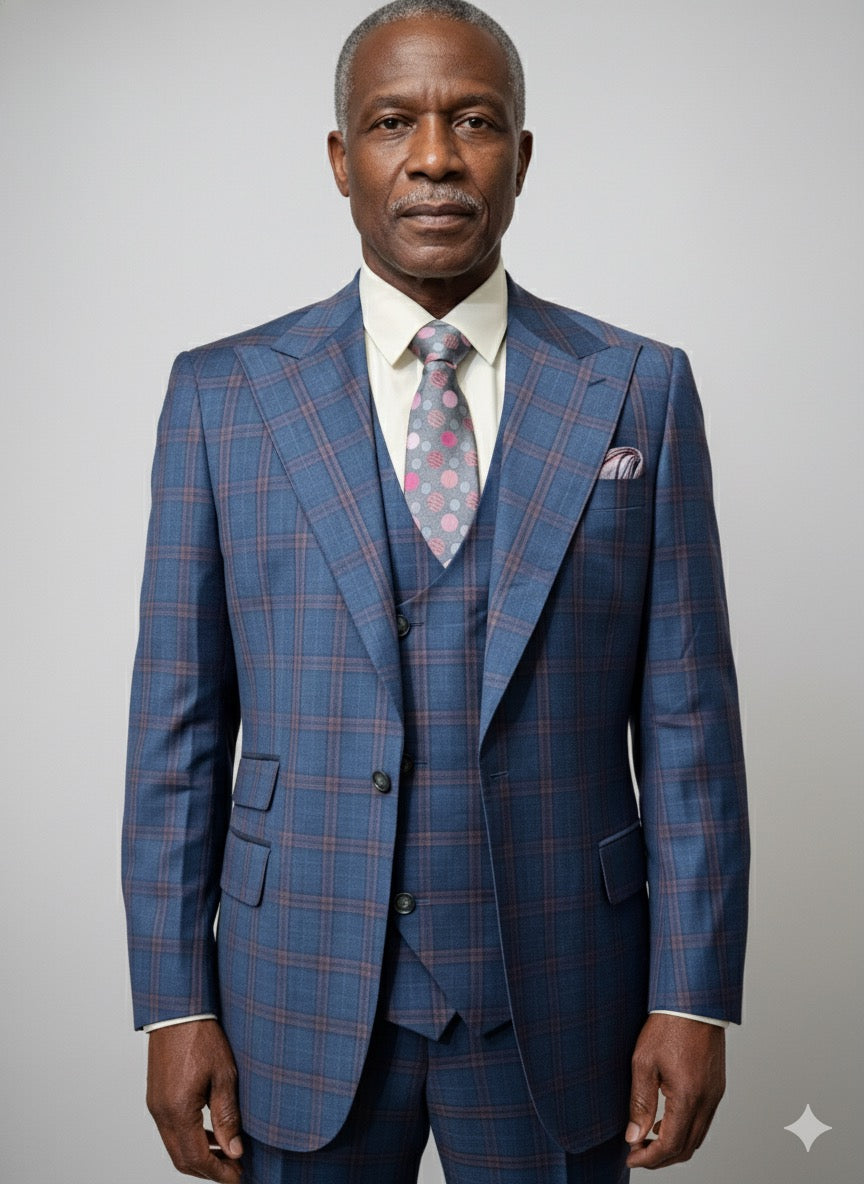An older man wears a Tiglio Rosso Orvietto Teal Blue/Rust Window Pane suit (TL9340) with a white shirt and patterned tie, standing against a plain background.