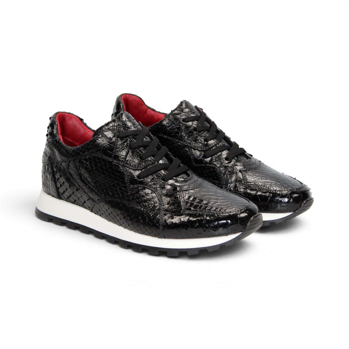 The Fennix 3538 Black sneaker by Fennix of Italy features a black textured upper, white sole, black laces, and a subtle red interior lining. Shown in a left side profile view against a plain white background, this shoe exemplifies Italian craftsmanship and meticulous attention to detail.