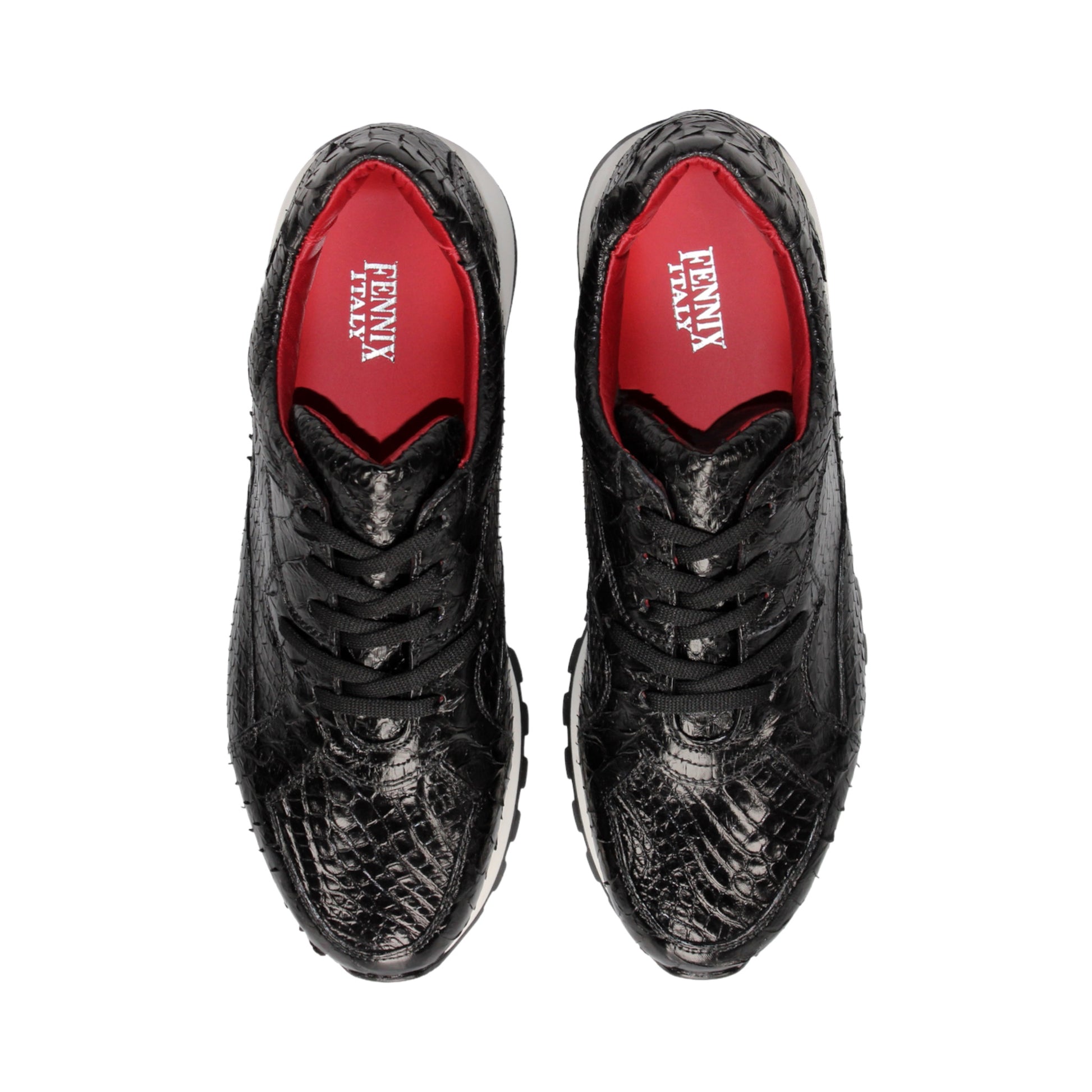 The Fennix 3538 Black sneaker by Fennix of Italy features a black textured upper, white sole, black laces, and a subtle red interior lining. Shown in a left side profile view against a plain white background, this shoe exemplifies Italian craftsmanship and meticulous attention to detail.
