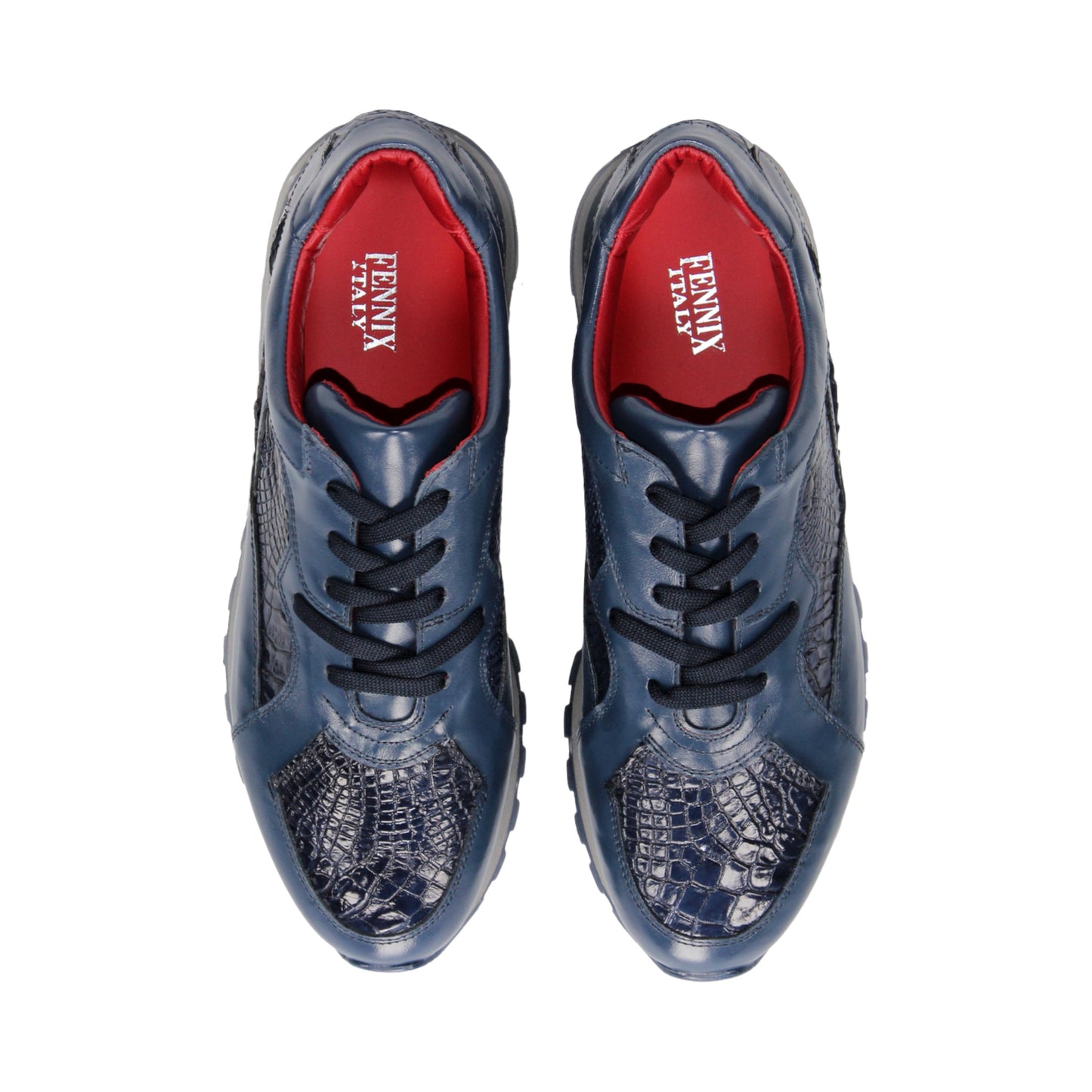 The Fennix 3538 Navy by Fennix of Italy features textured, crocodile-inspired navy blue panels, black laces, a red interior lining, and a grey sole. Shown in side profile against a white background, this sneaker exemplifies Italian craftsmanship and embodies the allure of exotic luxury footwear.