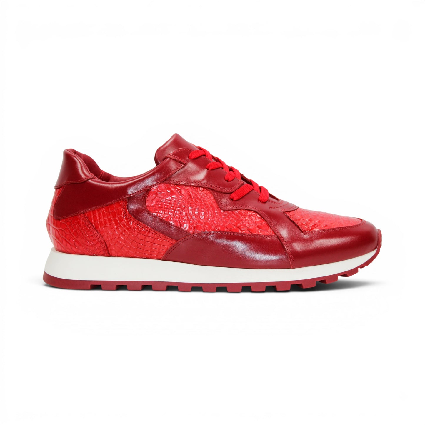 The Fennix 3538 Red by Fennix of Italy is a red athletic sneaker featuring a textured surface reminiscent of exotic leather, matching red laces, and a white midsole paired with a red outsole, displayed in profile view. Its expert craftsmanship provides a subtle nod to luxury Italian footwear, seamlessly blending style and sport in one sleek design.