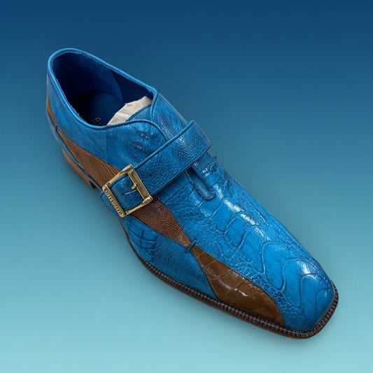 A BELVEDERE Belvedere Shoe 7 in blue and brown leather with a gold buckle, size 9 only, is displayed on a wooden surface. This item is a final sale—no exchange or return.