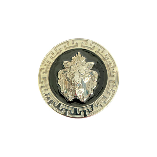 The Matiste Black/Silver Belt Buckle 35mm B35 features a raised lion head on a black background with a Greek key border—a bold statement accessory by Matiste for your belt.