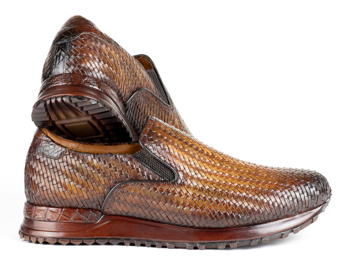 A pair of Paul Parkman Men's Brown Woven Leather Slip-On Sneakers (LW204BRW) featuring a textured sole and tan lining.