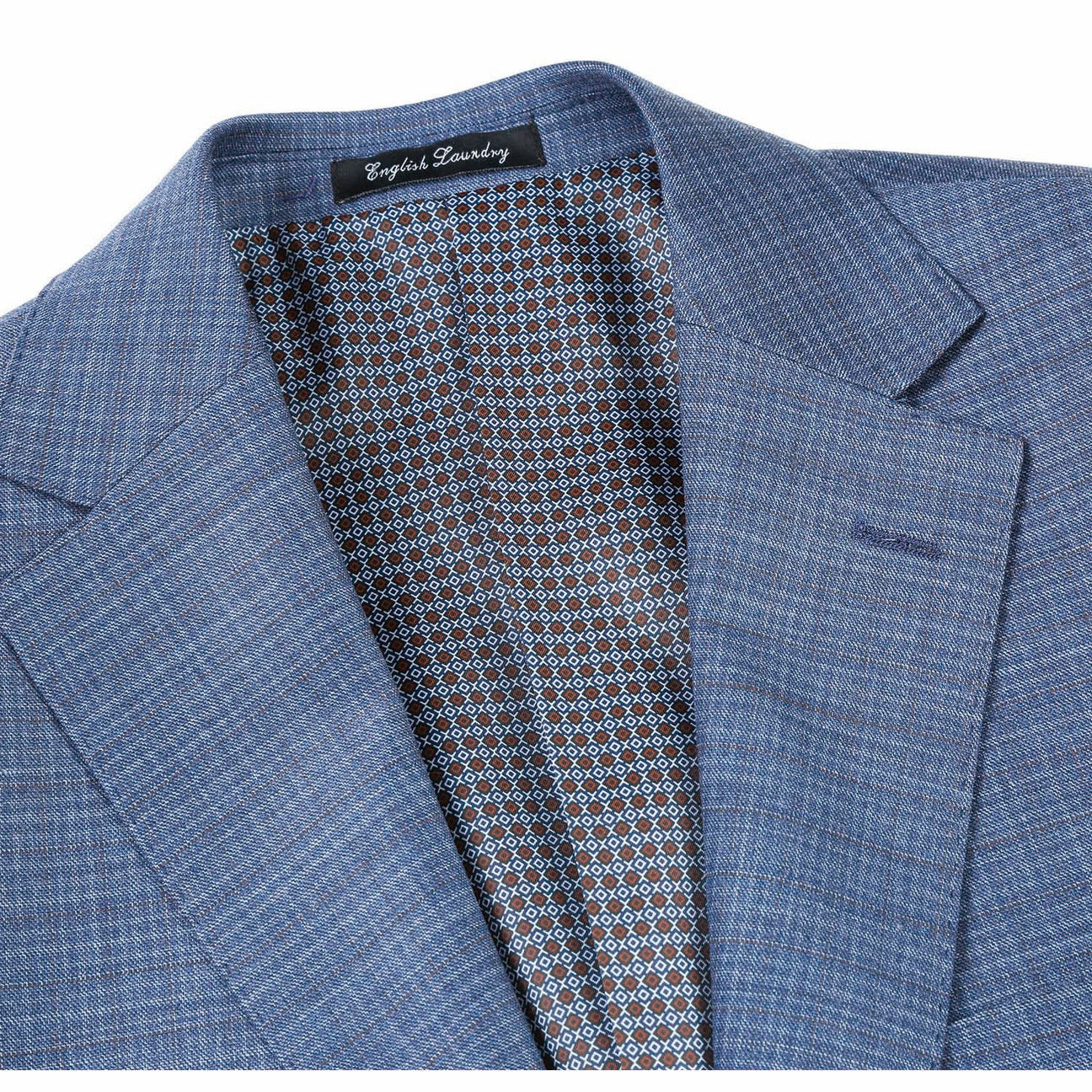 The ENGLISH LAUNDRY Pale Blue Wool Suit EL82-60-402, featuring a slim fit with a subtle check pattern and stylish notch lapels, pairs perfectly with a crisp white dress shirt and an orange patterned tie, elegantly displayed on a mannequin.