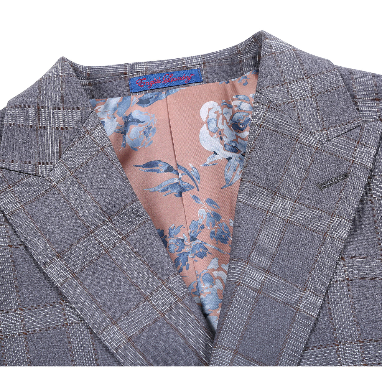 The ENGLISH LAUNDRY 2pc Suit Brown 32-68-092EL by English Laundry features a slim fit, two-button closure, notched lapels, and a partially visible floral patterned inner lining.
