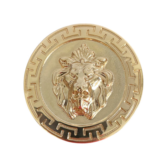 The Matiste Gold Belt Buckle 40mm B40 by Matiste features a gold circular design with a raised lion head and geometric border, inspired by an enamel lion emblem for a refined touch of Italian luxury.