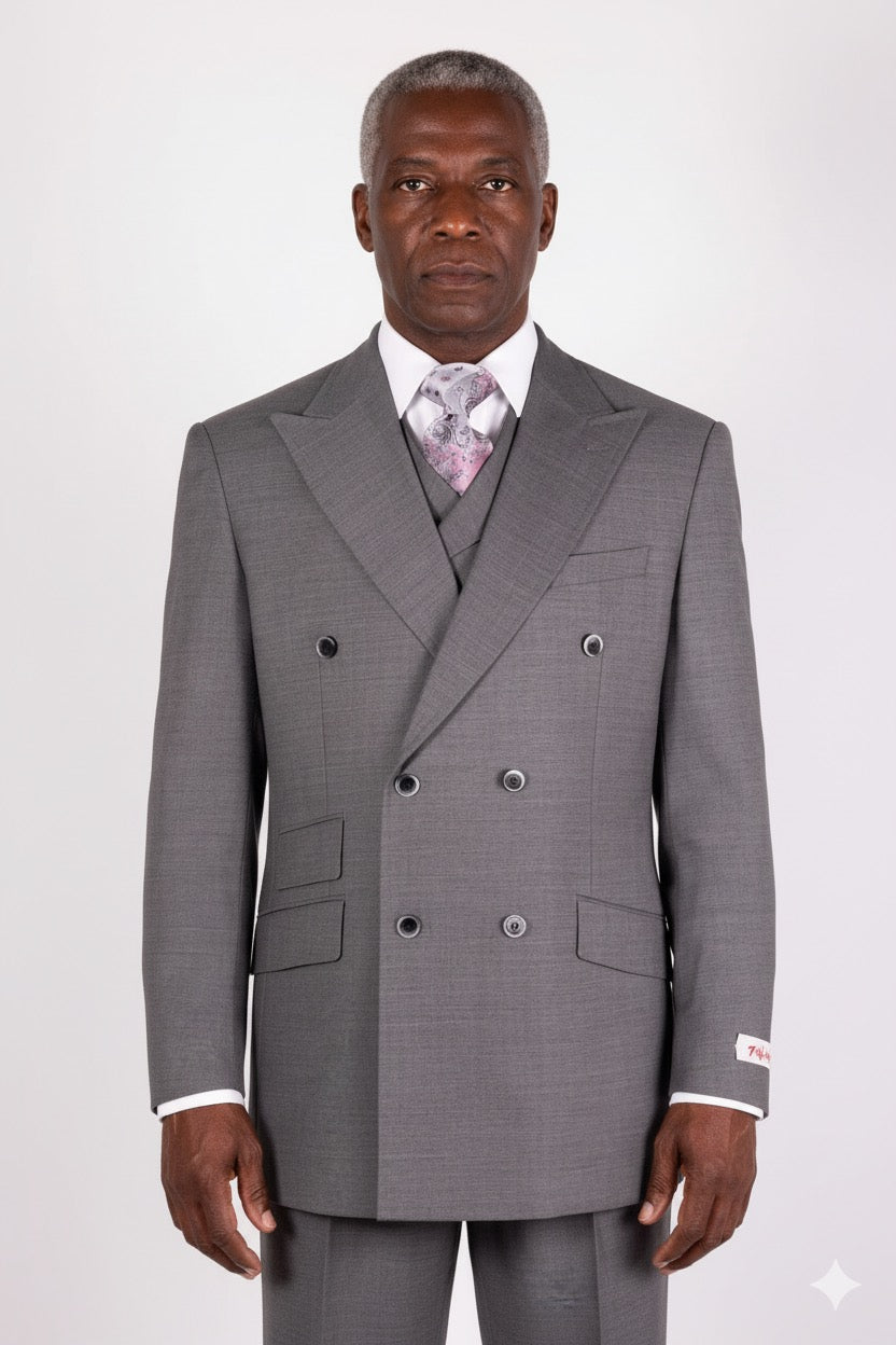 The Tiglio Rosso DB Este Solid Grey E09063/26, exquisitely designed by Tiglio Rosso, is a sophisticated double-breasted suit made from 100% wool, featuring peak lapels. It pairs effortlessly with a crisp white shirt and patterned tie, offering a refined touch that elevates classic style.