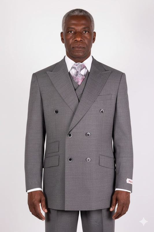 The Tiglio Rosso DB Este Solid Grey E09063/26, exquisitely designed by Tiglio Rosso, is a sophisticated double-breasted suit made from 100% wool, featuring peak lapels. It pairs effortlessly with a crisp white shirt and patterned tie, offering a refined touch that elevates classic style.
