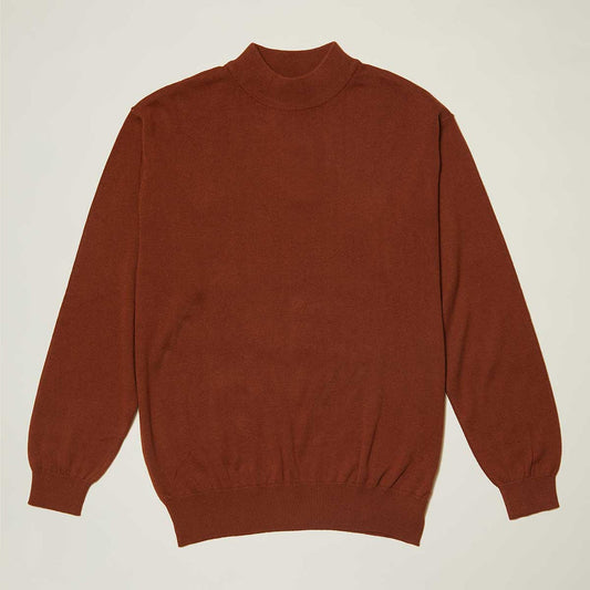 The Inserch Cotton Blend Mock Neck Sweater Aztec 4308-00027 is a rust-colored, regular fit, long-sleeve sweater with a high crew neckline, ribbed cuffs and hem, crafted from a soft cotton blend.