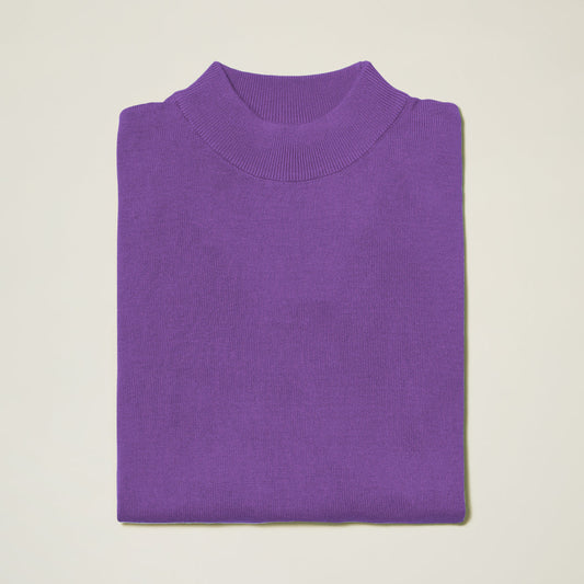 The Inserch Cotton Blend Mock Neck Sweater in Amethyst (4308-00180) features a high ribbed neckline, neatly folded and displayed on a plain light background.