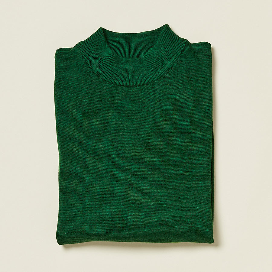 An Inserch Cotton Blend Mock Neck Sweater in Green Sapphire (style 4308-00201) is folded and laid flat on a light background.