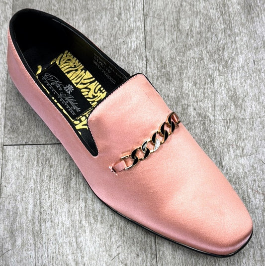 The Exclusive Formal Dress Shoe Salmon 6978 from UNIQUE DESIGN MENSWEAR, crafted from genuine leather and embellished with a gold chain, rests elegantly on a gray tiled floor.