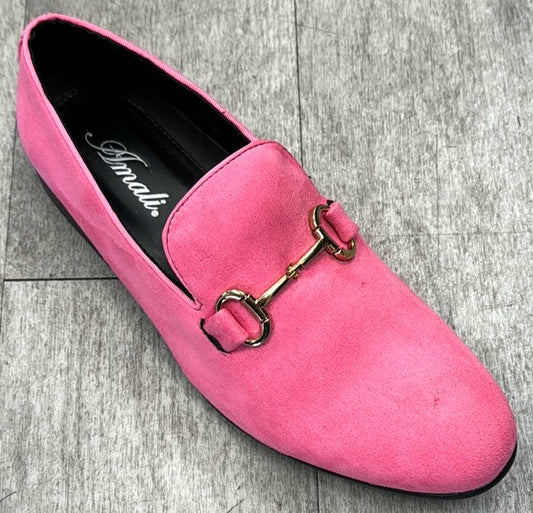 The "Exclusive Formal Dress Shoe Pink BRADFORD" by UNIQUE DESIGN MENSWEAR lies gracefully on a gray tiled floor, showcasing Italian sophistication with its pink suede leather and gold decorative buckle.