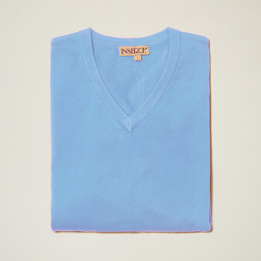 The Inserch Cotton Blend V-Neck Sweater 4608-00183 in Blue Mist, with a visible Inserch label, is neatly folded on an off-white background.