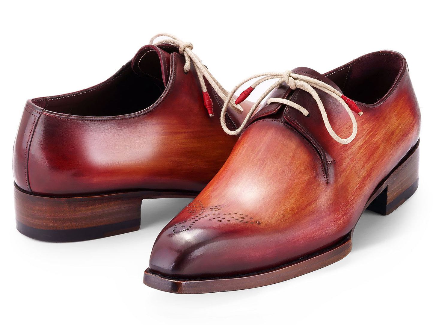 The Paul Parkman Goodyear Welted Derby Shoes 468R21 feature polished, hand-painted leather in a reddish brown gradient with light laces and perforated toe caps, blending style and craftsmanship from the renowned Paul Parkman brand.