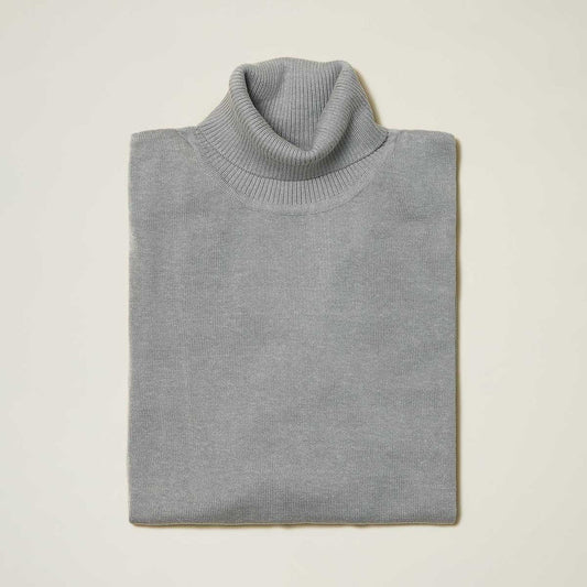 The Inserch Cotton Blend Turtleneck Sweater Grey 4708 by Inserch is neatly folded on a plain, light surface.