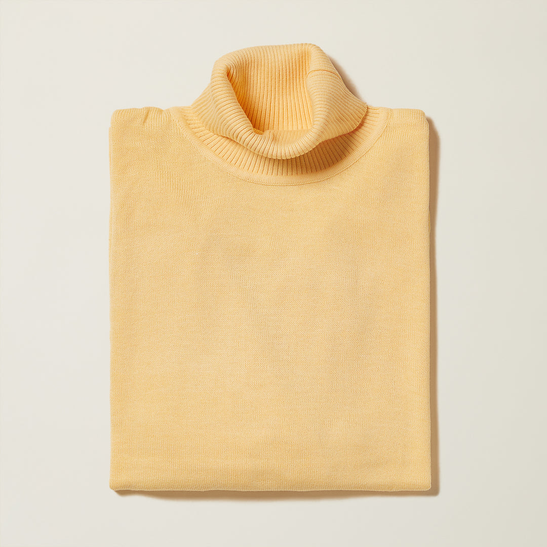 Close-up of the texture and stitch pattern on the Inserch Cotton Blend Turtleneck Sweater in Banana Cream, style 4708, showcasing the soft cotton-acrylic knit by Inserch.