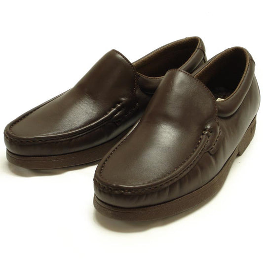The P-4746-628 Brown Slip on Loafer by Pinoso's, made in Spain, features brown leather, stitched detailing, thick rubber soles, and handcrafted comfort, shown on a white background.