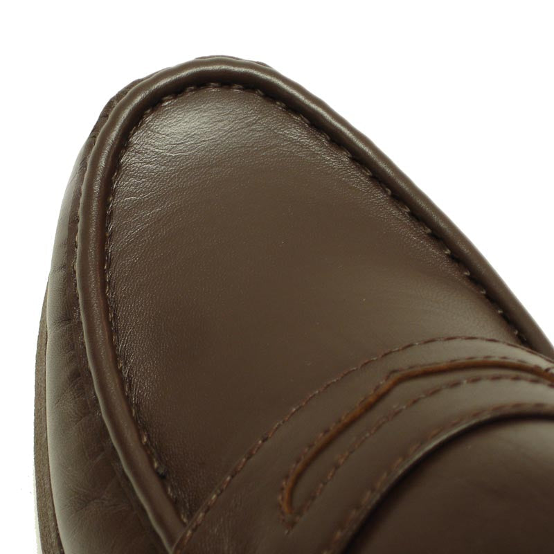A pair of Pinoso's P-4804-628 Brown Slip on Penny Loafer for men, made in Spain, crafted in brown Nappa leather with a stitched design and low heels, displayed on a white background.
