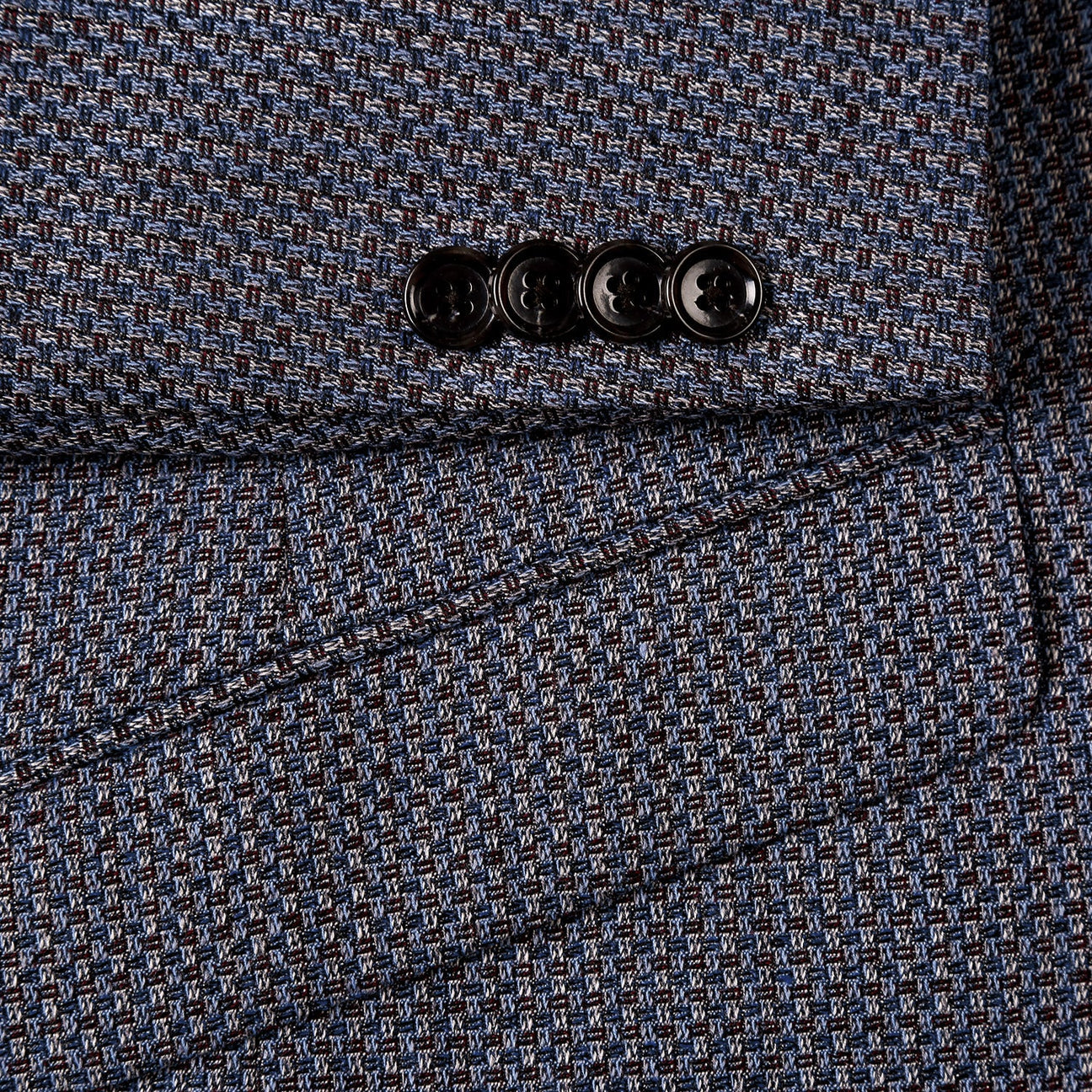 The Renoir Alessandro Vitello Slim Fit Wool Blend Brown Blazer 561-16 is displayed on a mannequin, single breasted and tailored, paired with a white dress shirt, blue and white patterned tie, and coordinating pocket square.
