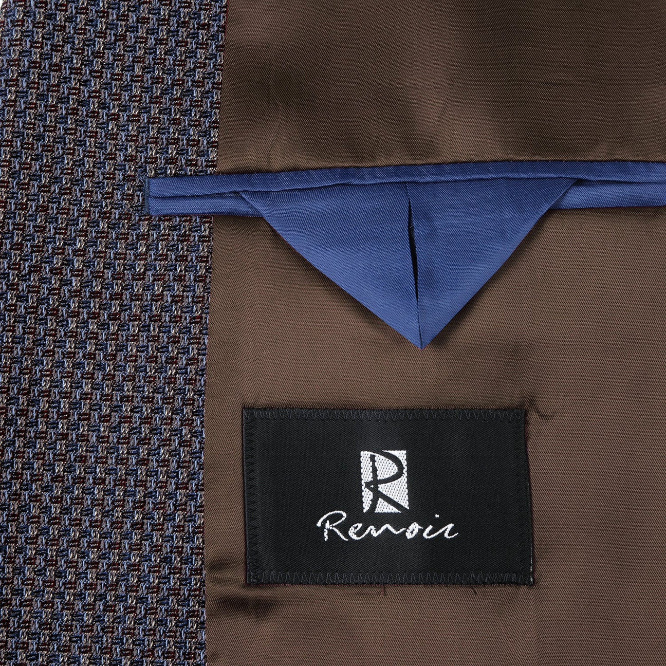 Close-up of the Alessandro Vitello by Renoir Slim Fit Wool Blend Brown Blazer 561-16 sleeve, featuring a blue and brown pattern with four black buttons in a row.