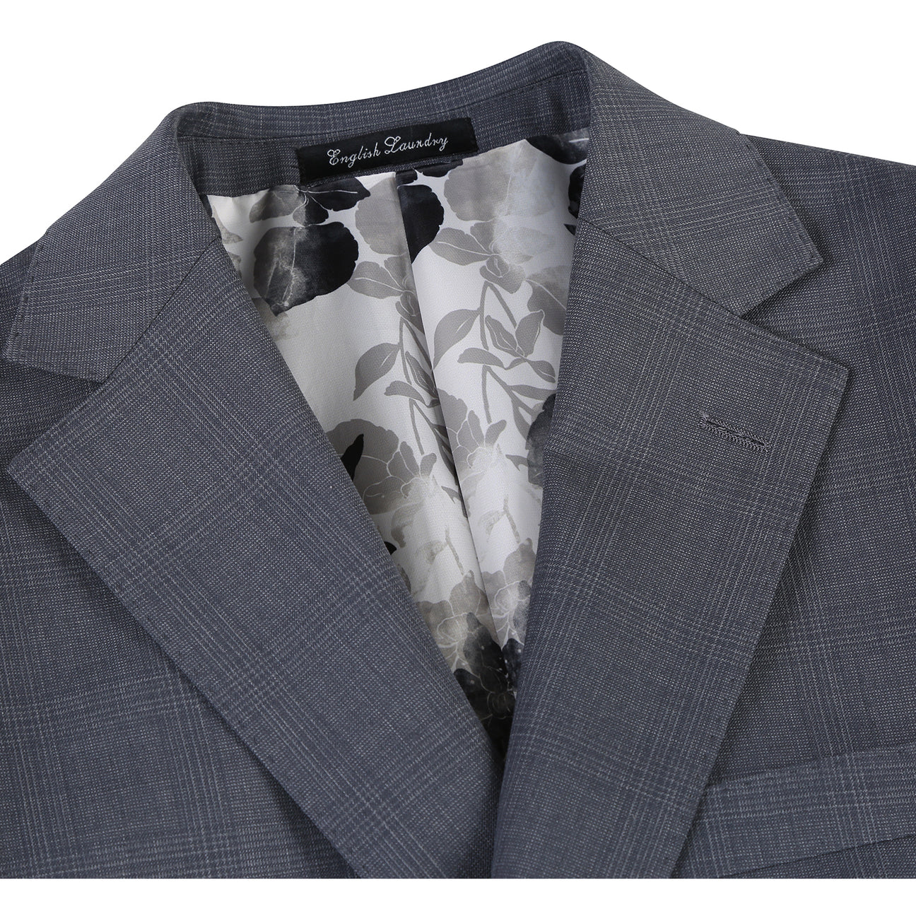 The English Laundry Grey Wool Suit EL92-58-095 features a slim fit, notch lapels, two buttons, and flap pockets. Crafted from 90% wool, it's displayed over a white dress shirt and navy striped tie on a mannequin.